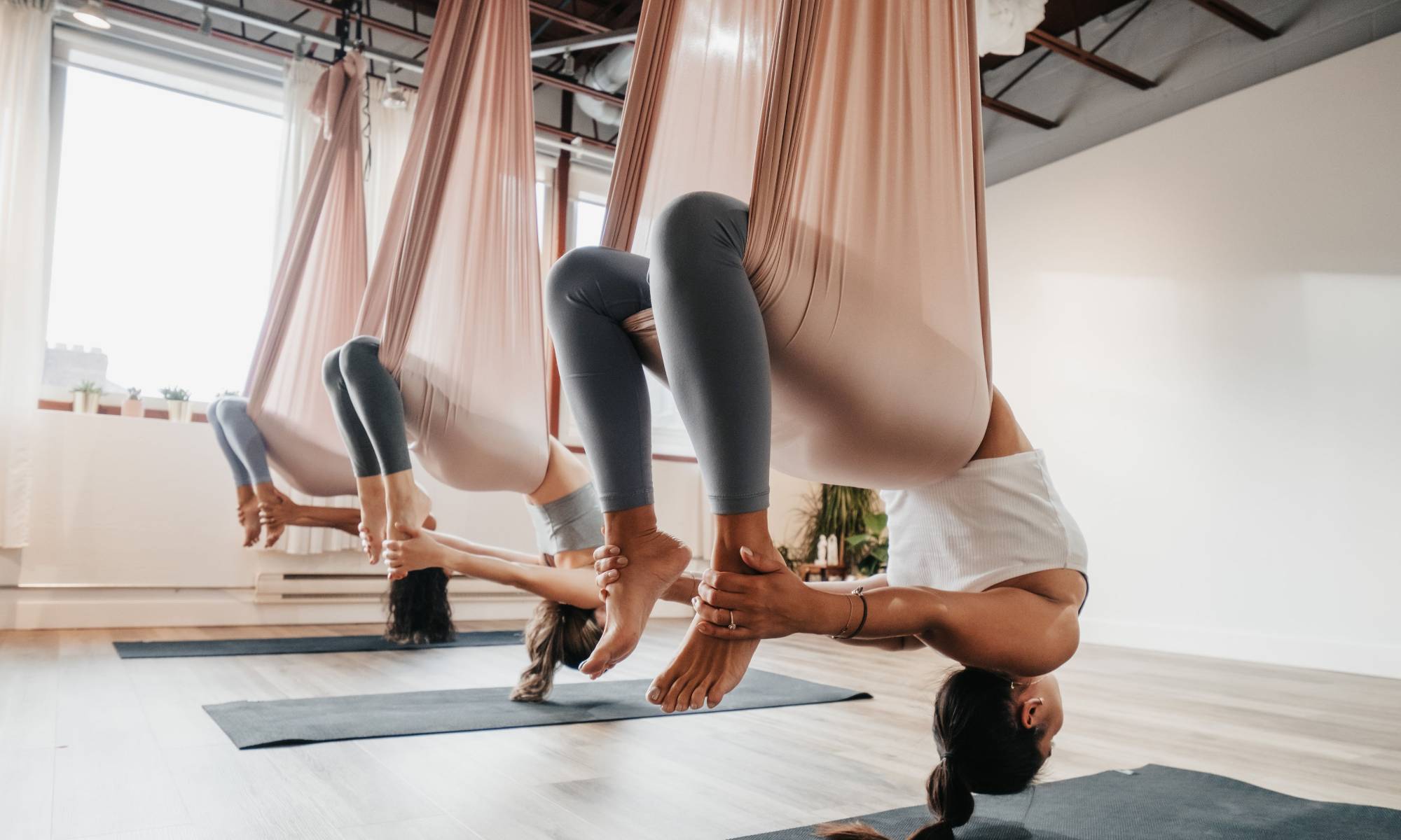 group aerial class at AT OM Yoga Toronto